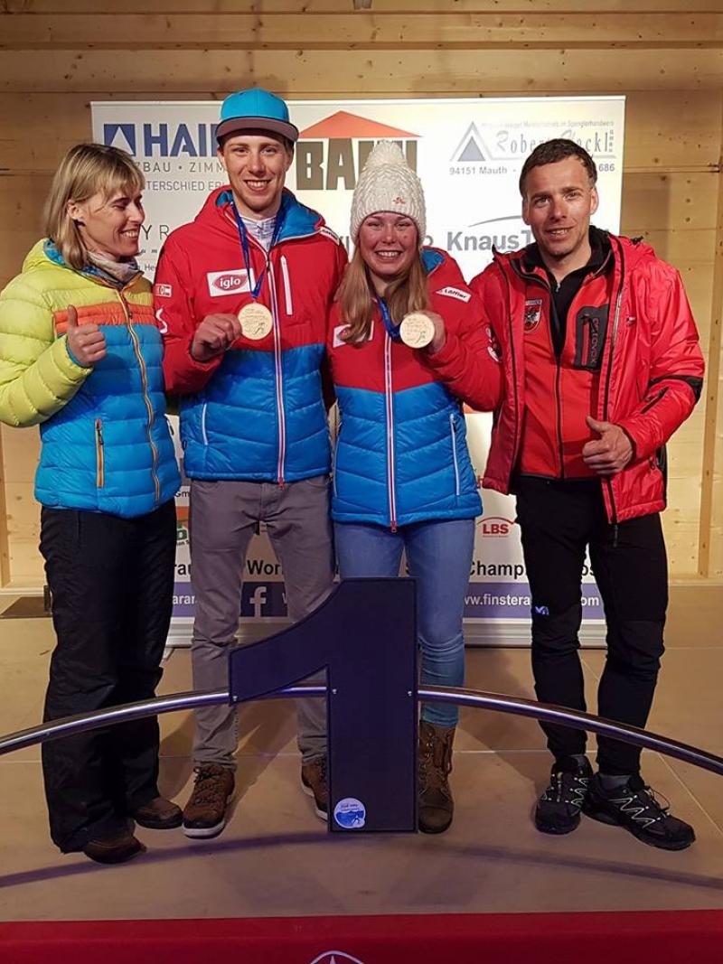 A young boy and girl with a man and a woman posing for the photo
