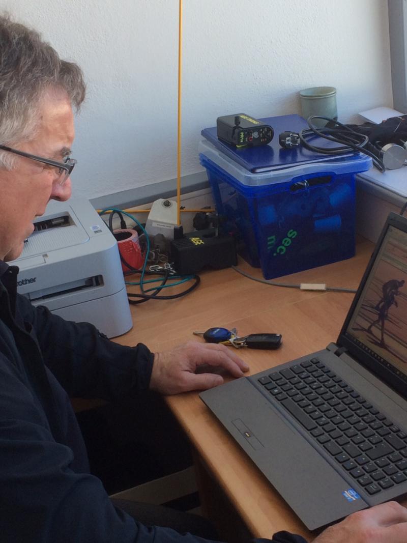 Man sitting in front of a computer