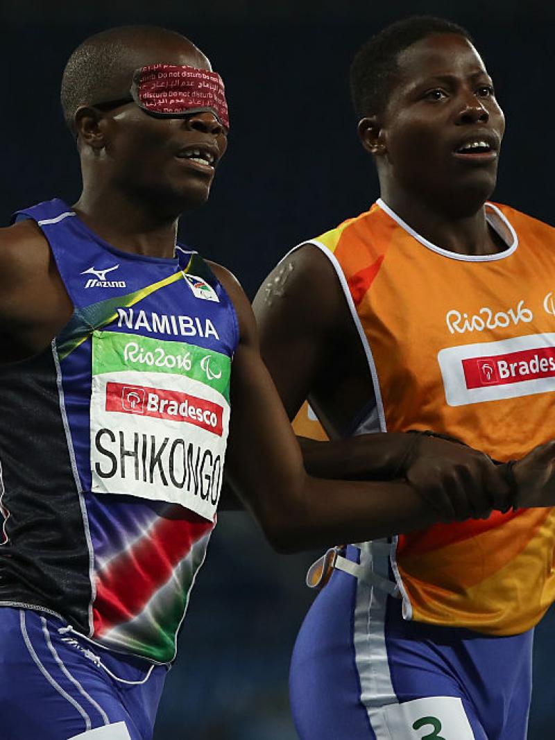 Ananias Shikongo and his guide Even Tjiviju of Namibia celebrates winning the gold medal in the Men's 200m - T11 Final at the Rio 2016 Paralympic Games.