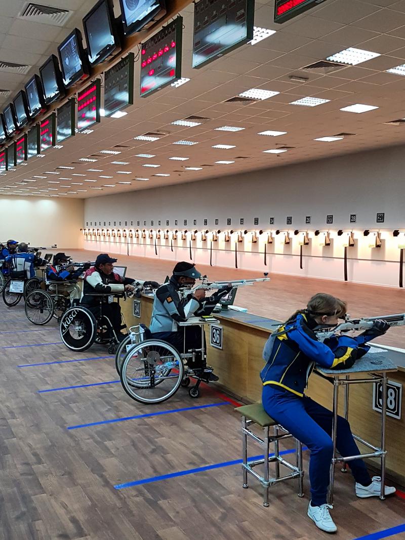 Shooting range with athletes in action