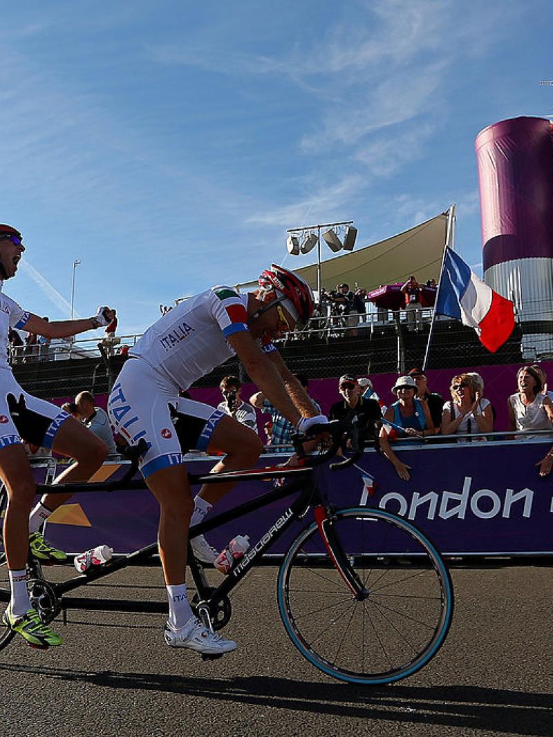 Ivano and Lucca Pizzi of Italy celebrate winning the Men's Individual B Cycling Road Race at the London 2012 Paralympic Games.