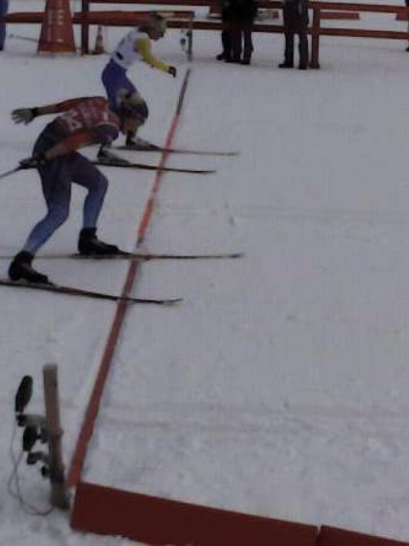 Two women's standing skiers cross the line at exactly the same time