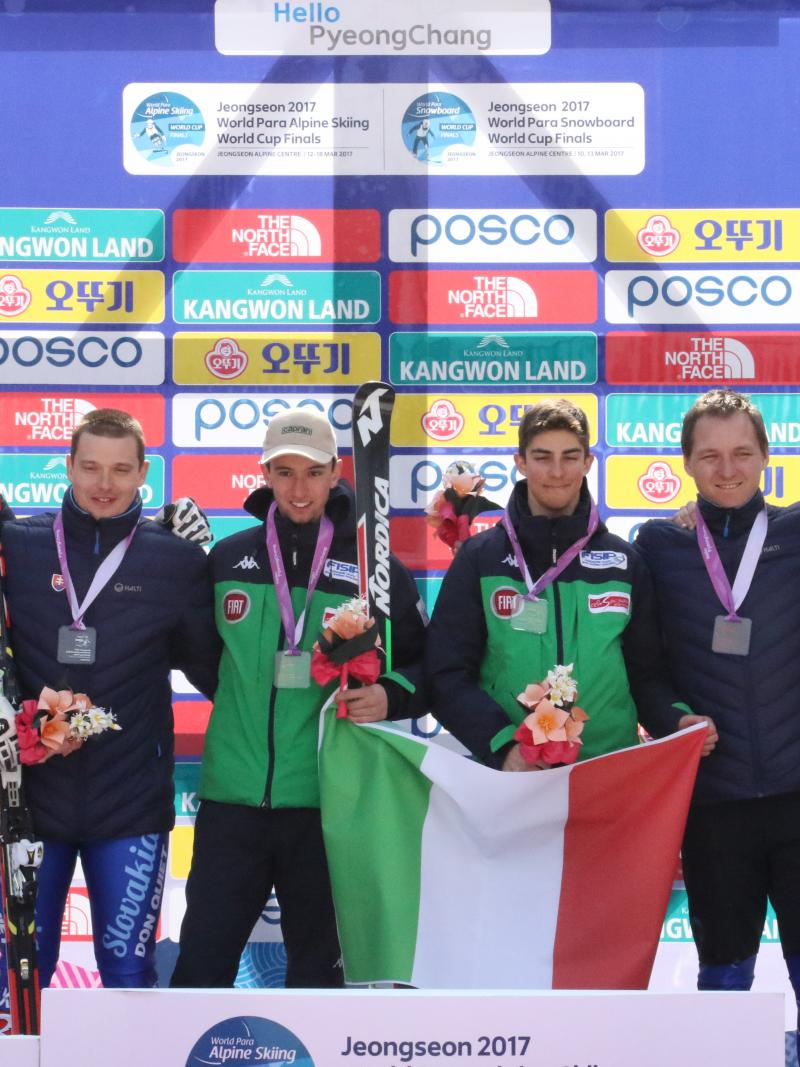 Six skiers on a podium