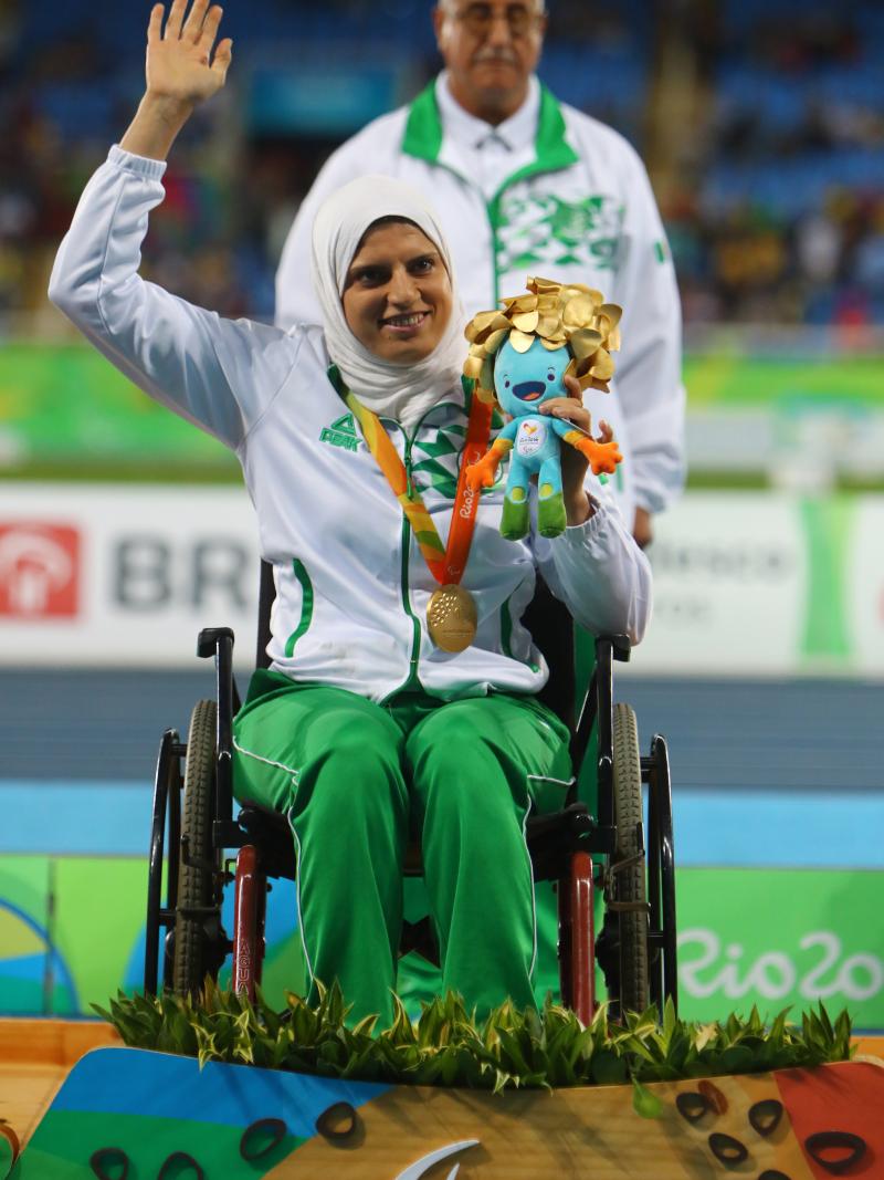 Gold medalist Asmahan Boudjadar of Algeria poses on the podium at the medal ceremony for women's shot put at Rio 2016.
