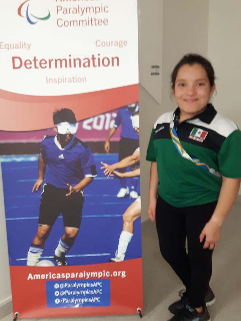 Short-statured Mexican swimmer poses for photo