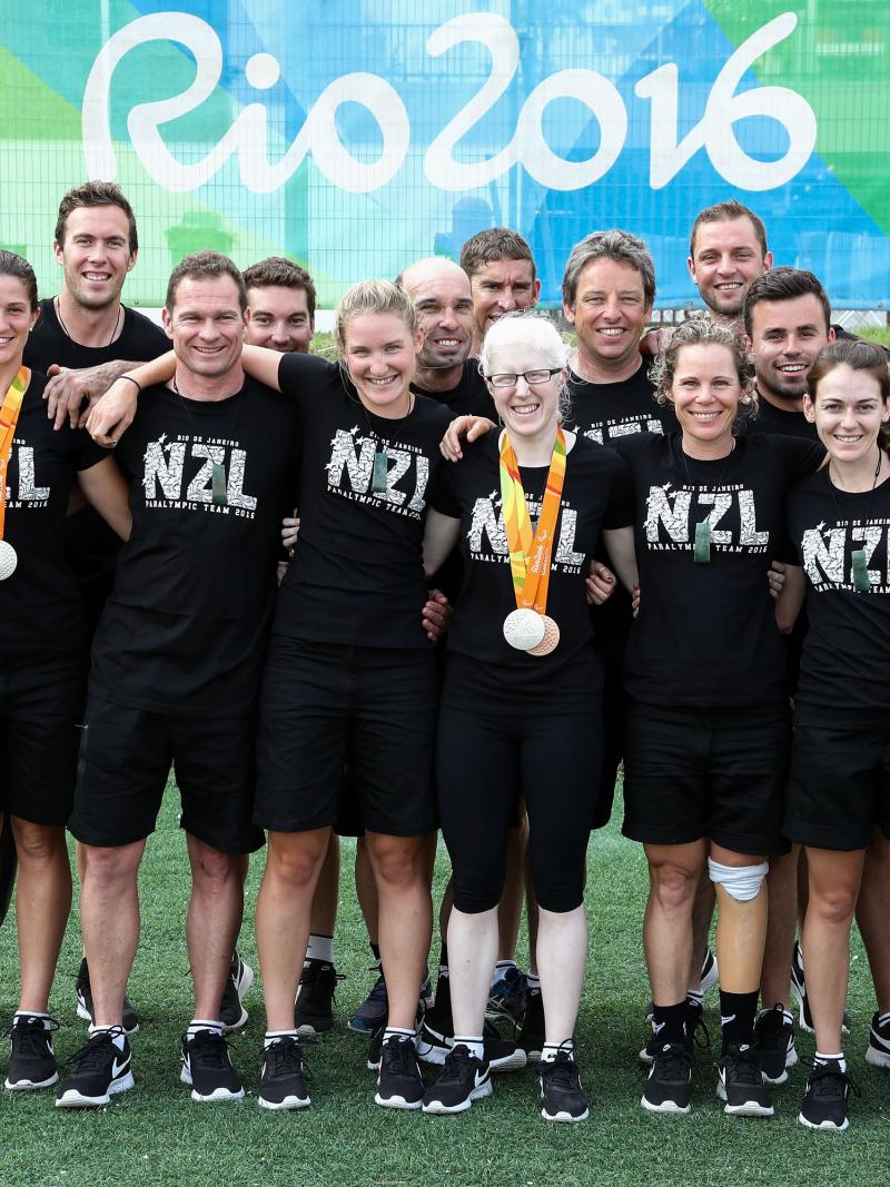 Group of Para cyclists gather together for a photo during the Rio 2016 Paralympics