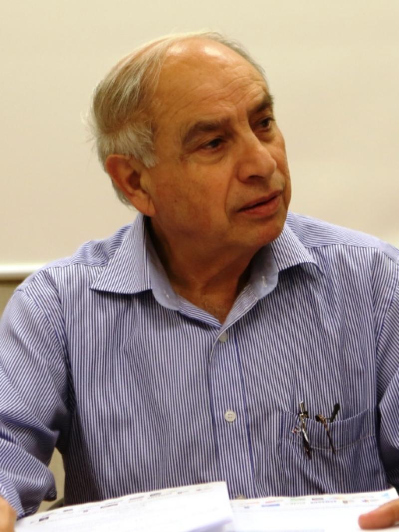 Upper-body photo of a man smiling