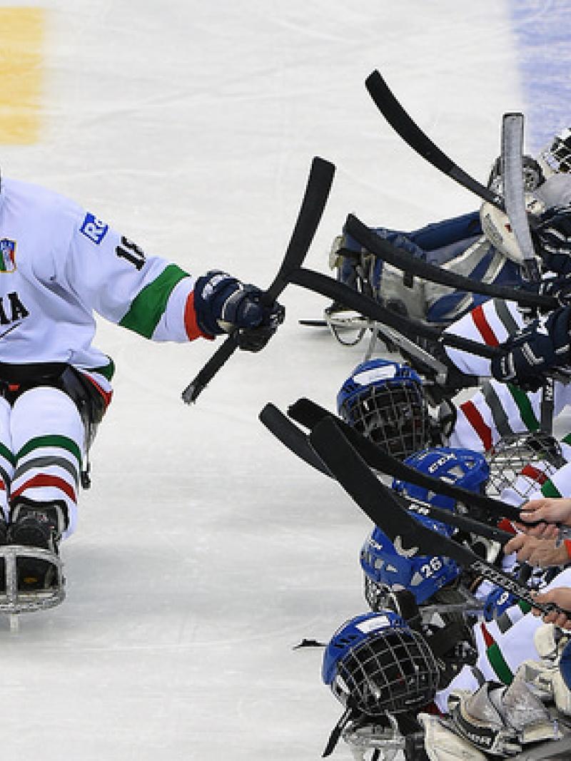 A Para ice hockey player celebrates a game win