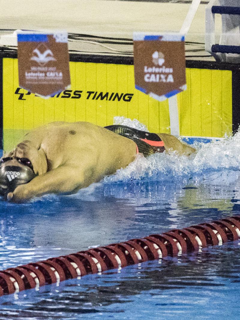 A swimmer with limb impairments starts his race