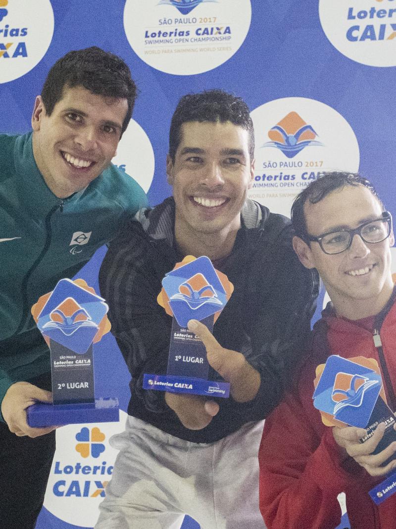 Para swimmers celebrate their podiums