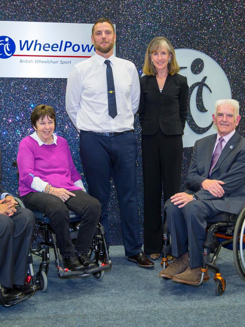 Five people posing for a photo
