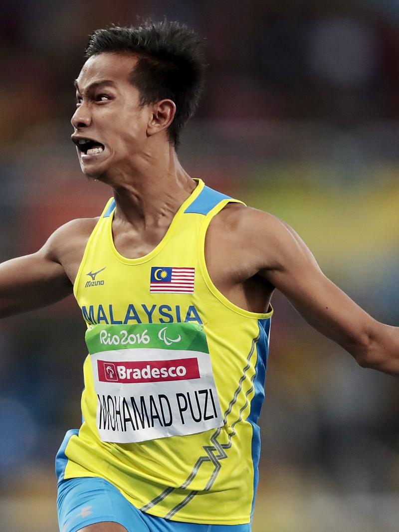 Malaysia's Mohamad Ridzuan Puzi reacts after victory in the men's 100m T36 final at the Rio 2016 Paralympic Games.