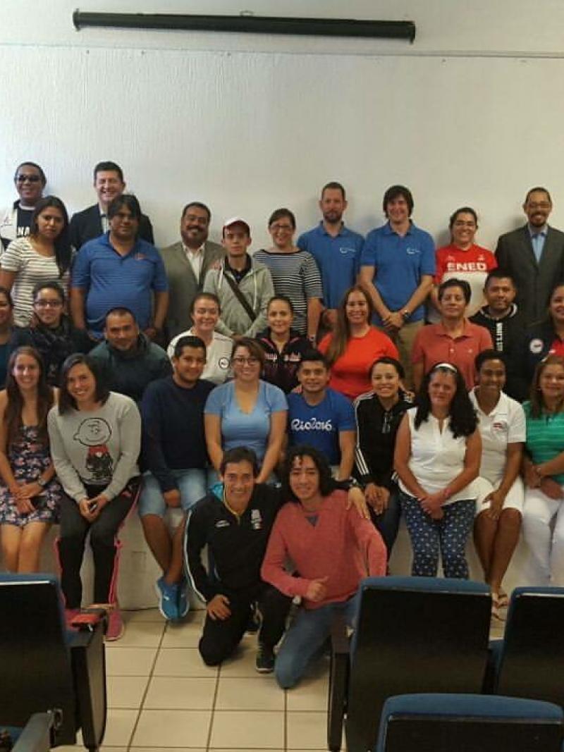 group of people in a room smiling