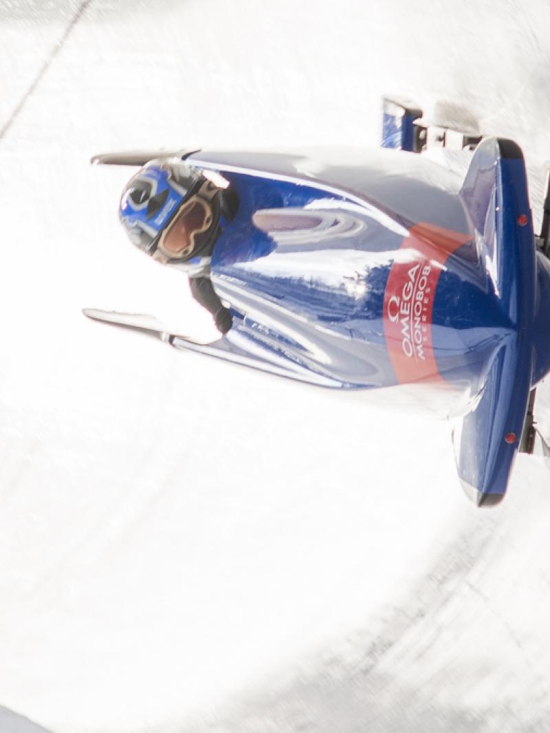 man in bobsleigh goes round bend