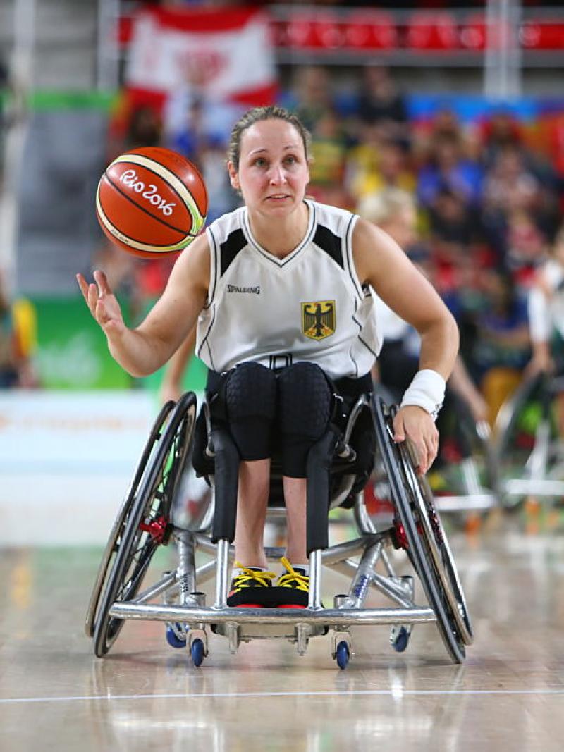 a wheelchair basketballer goes for a shot