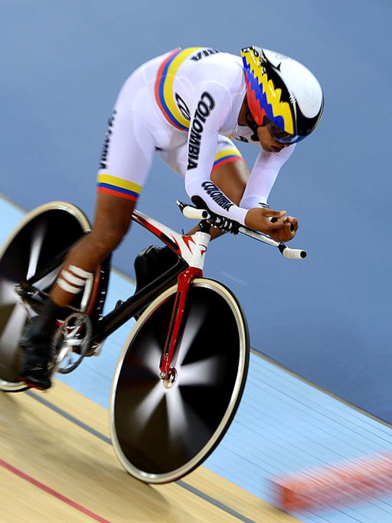 a para cyclist rides around the track