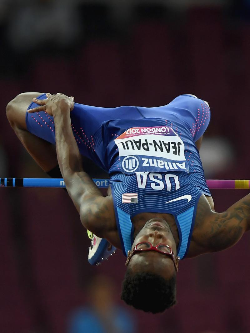 A man mid-leap in the high jump clearing the bar