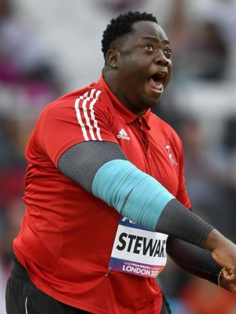 a para athlete finishes a javelin throw