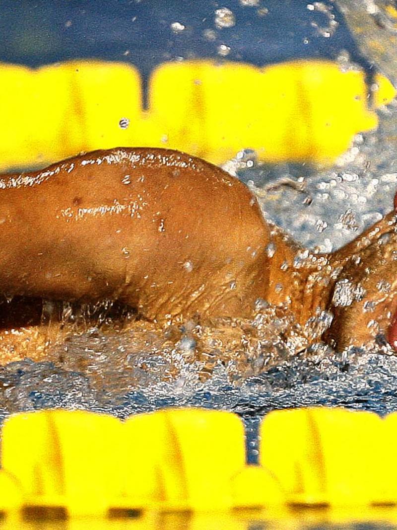 a para swimmer moves through the water