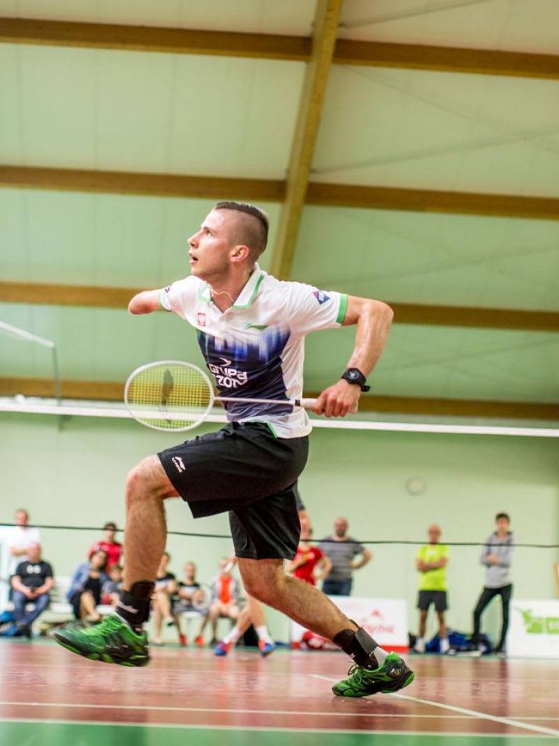 a Para badminton player goes for a shot