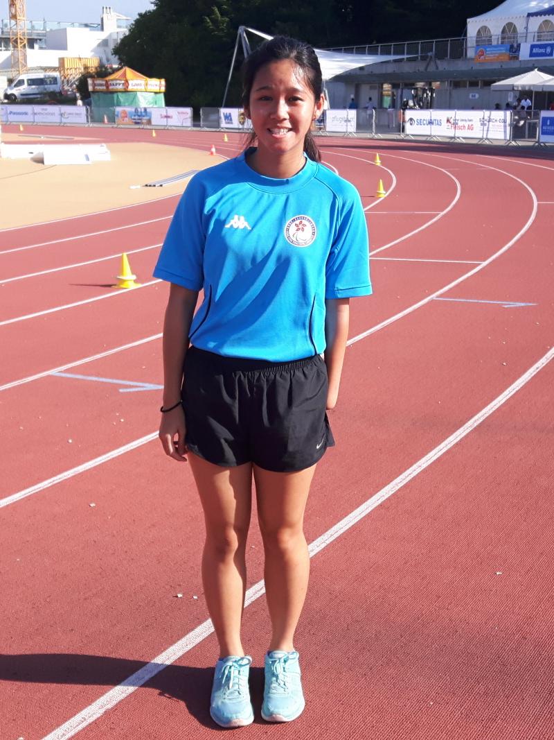 a female para athlete smiles for the camera