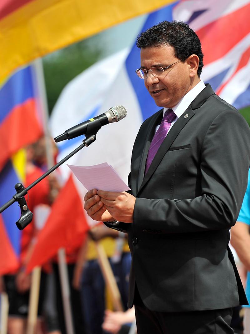 a man speaks at a podium