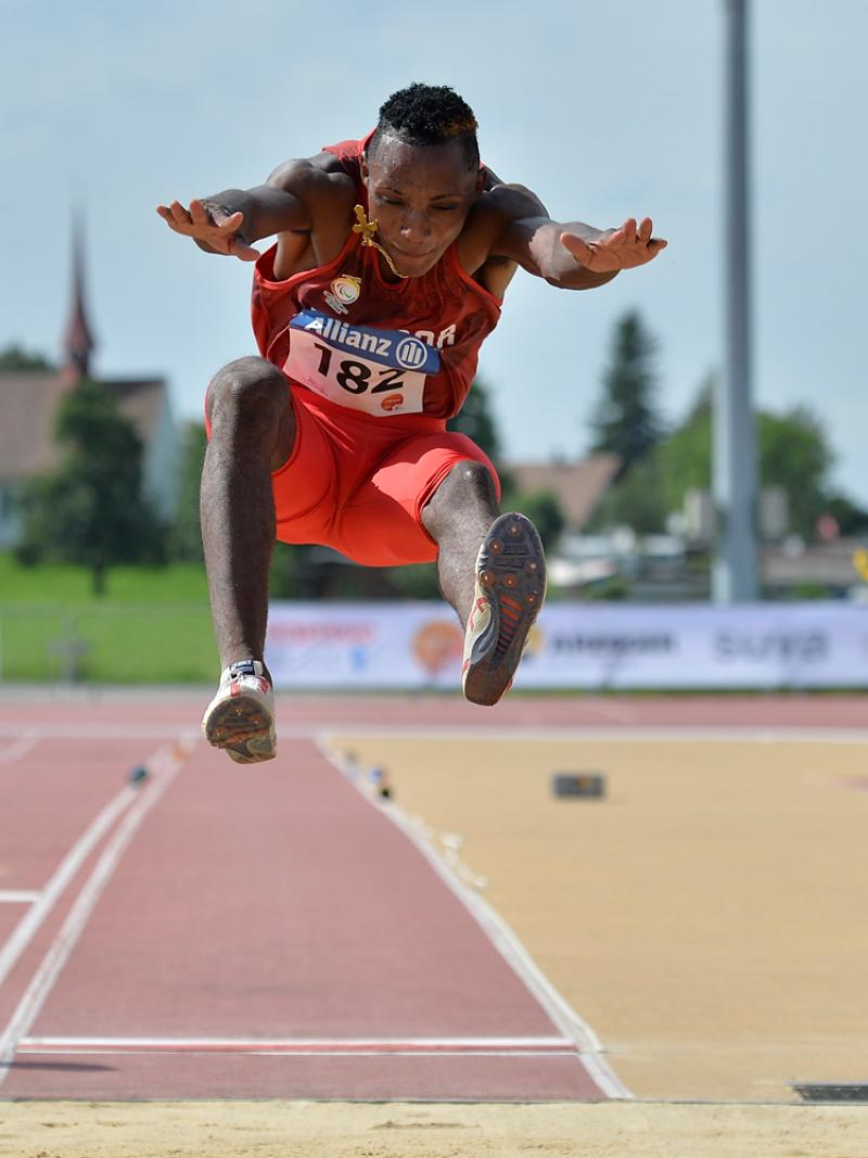 Man competing in long jump event