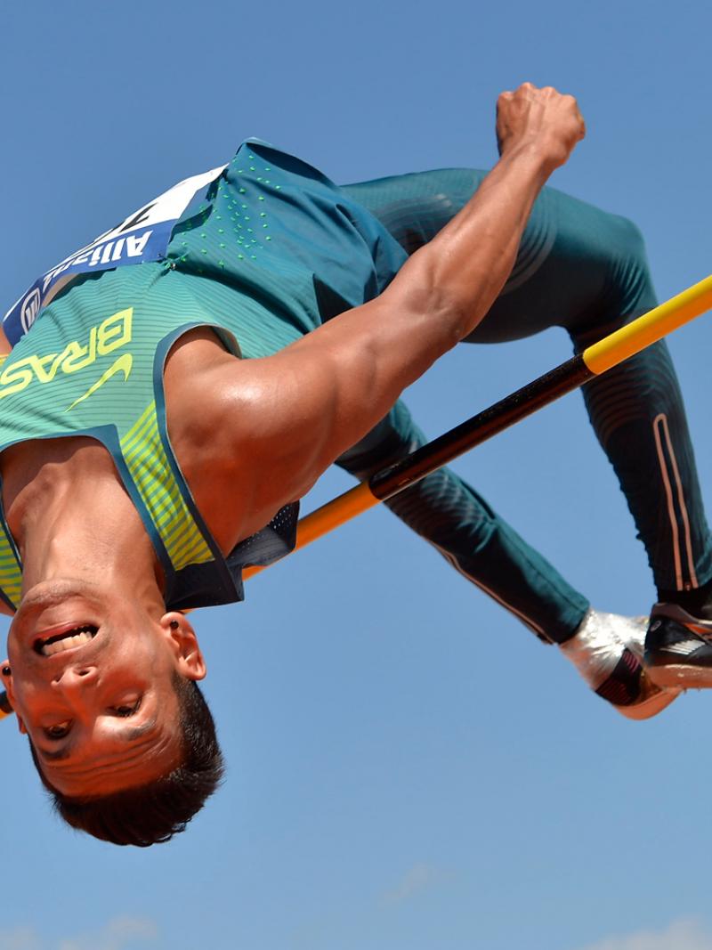 Brazilian athlete clears a bar in the high jump