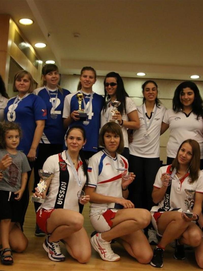 a group of goalball athletes smile for the camera