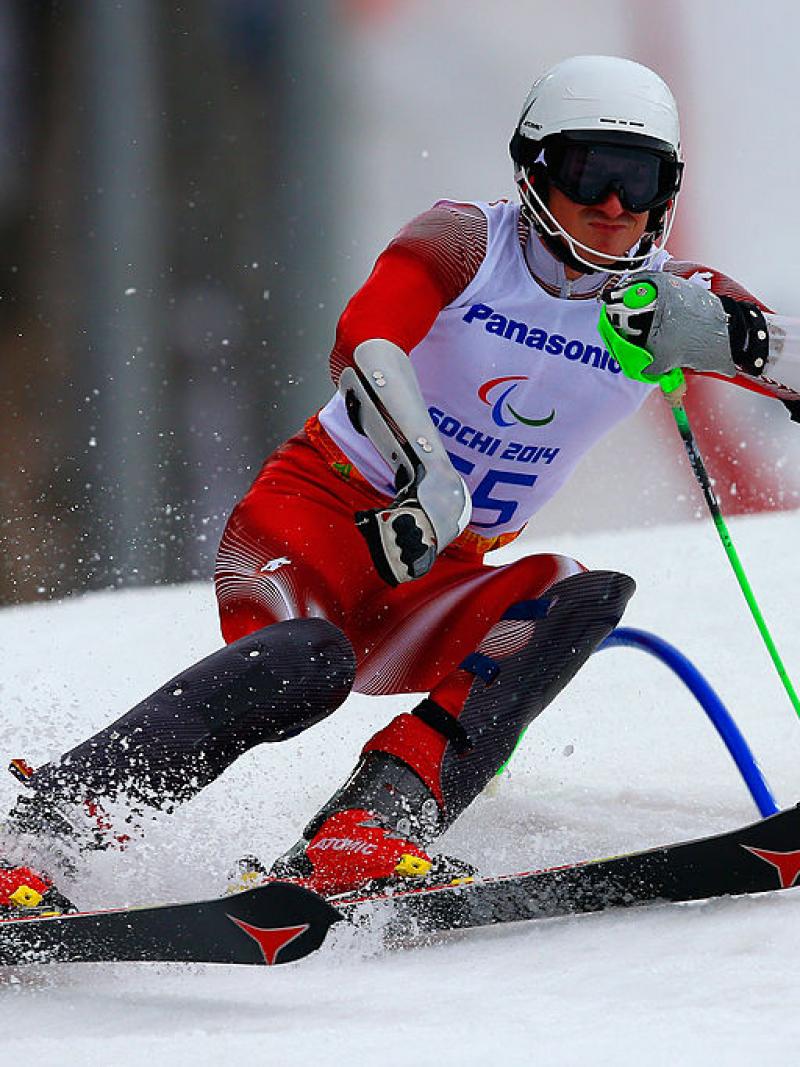 a Para skier goes through a gate