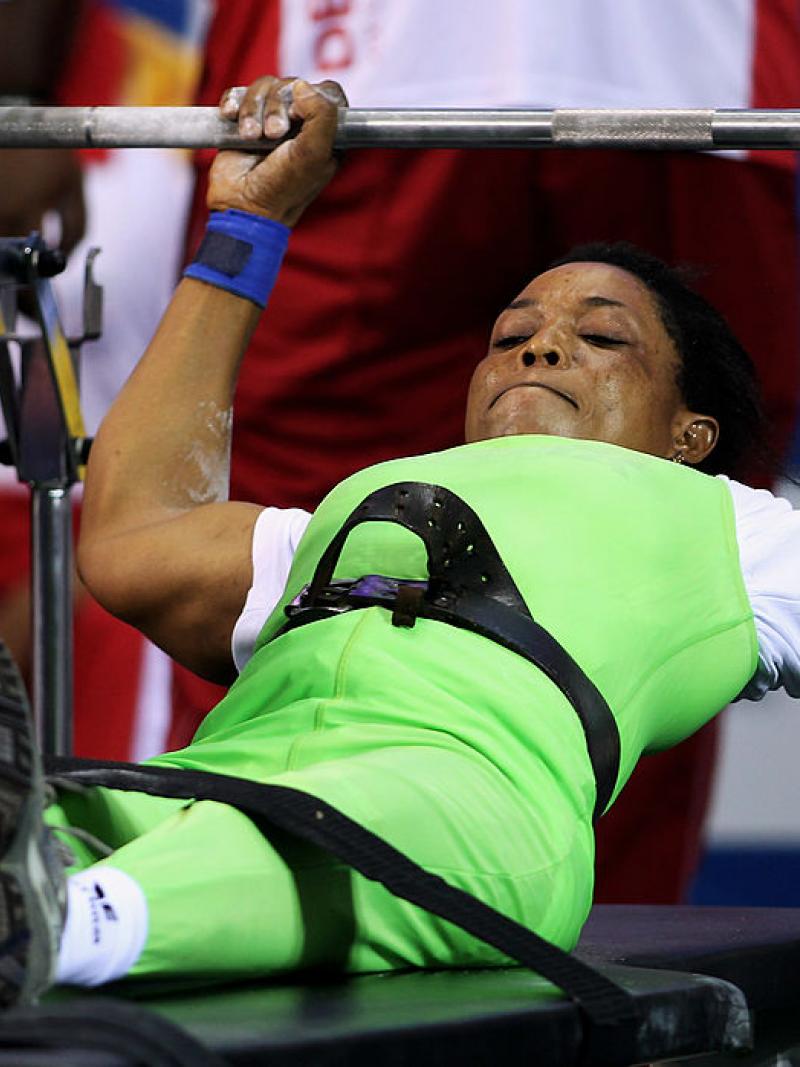 a female powerlifter prepares to lift