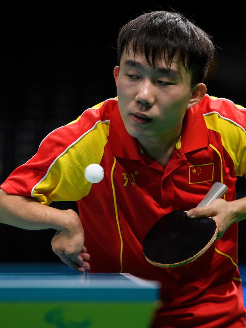 a Para table tennis player goes for a shot
