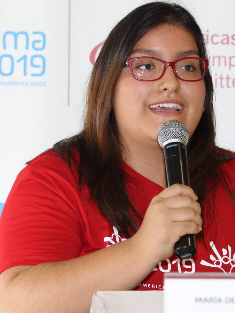 a Para swimmer speaks into a microphone