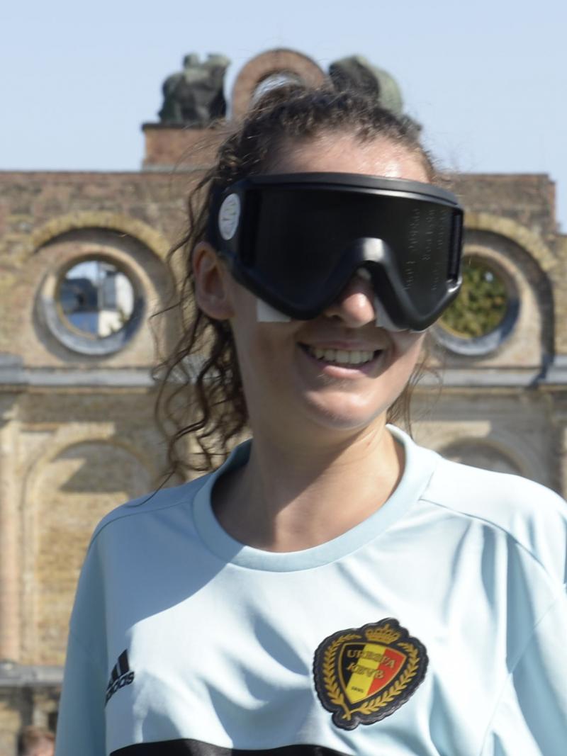 a female blind footballer smiles for the camera