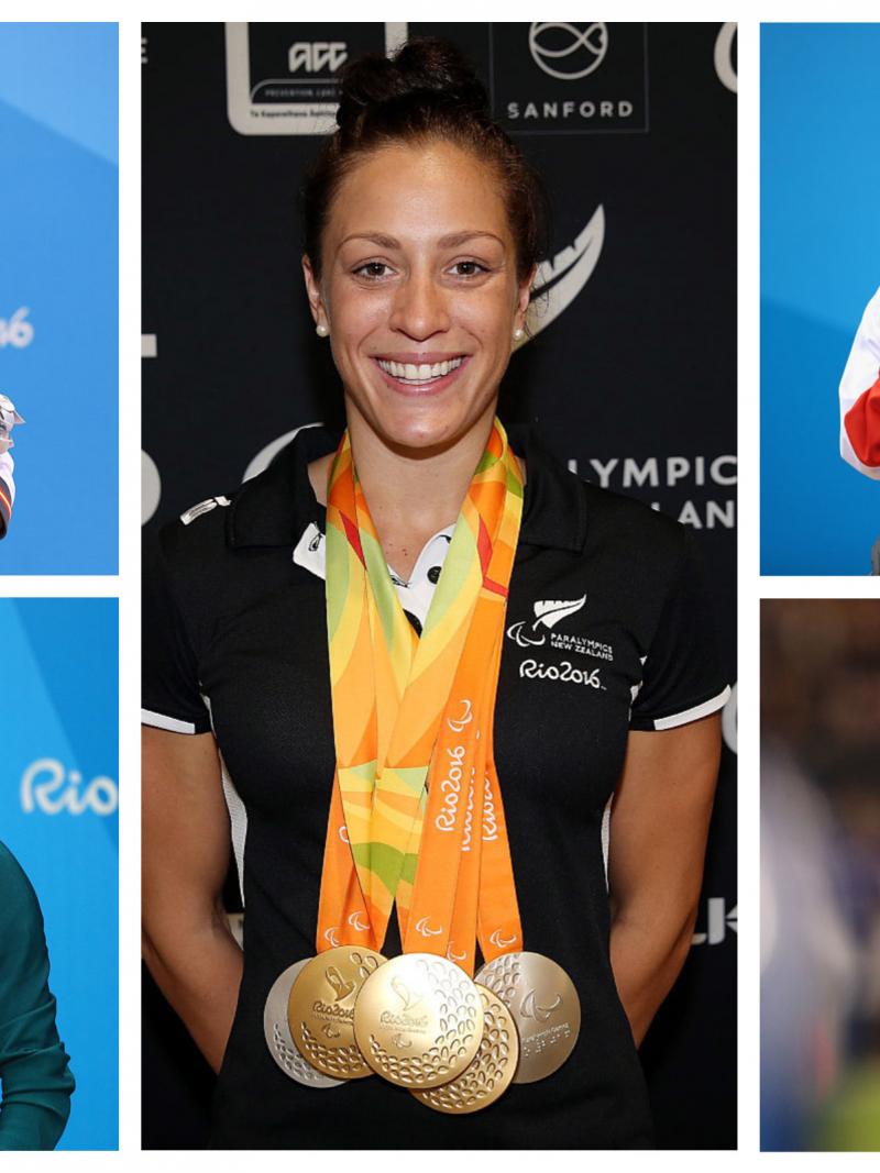 five Para swimmers smile on the podium