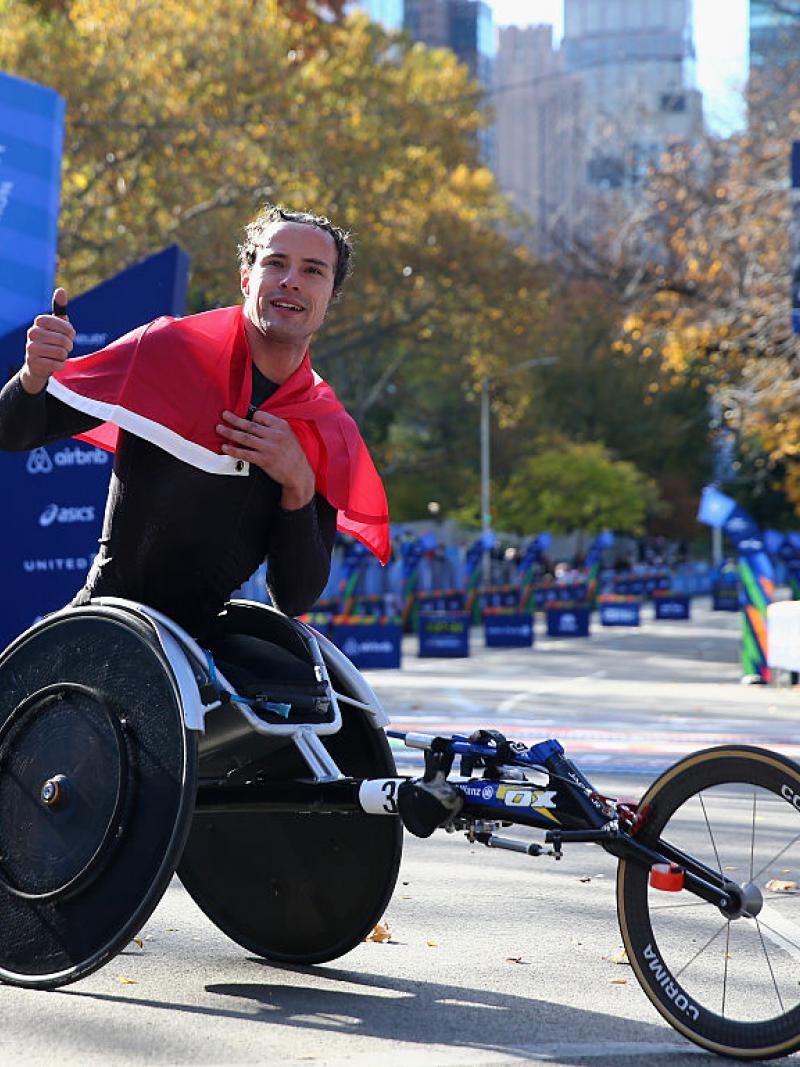 a male wheelchair athlete celebrates his win