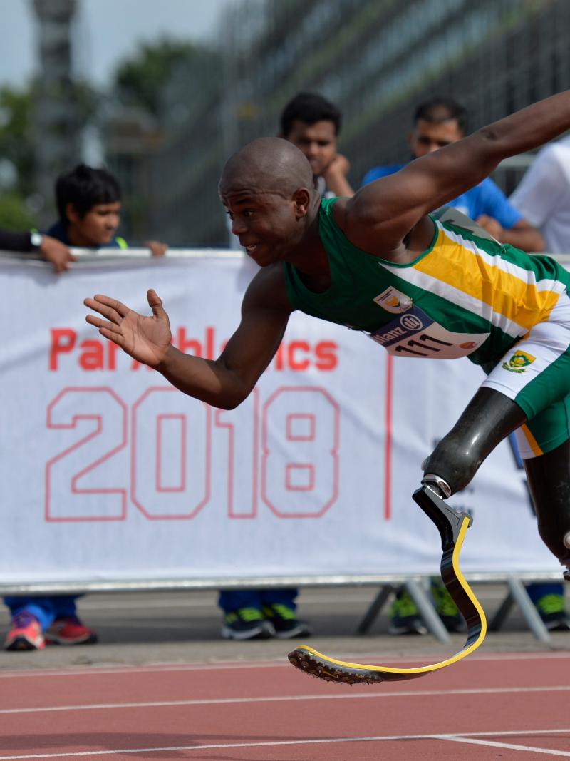 a male T44 sprinter starts from the blocks