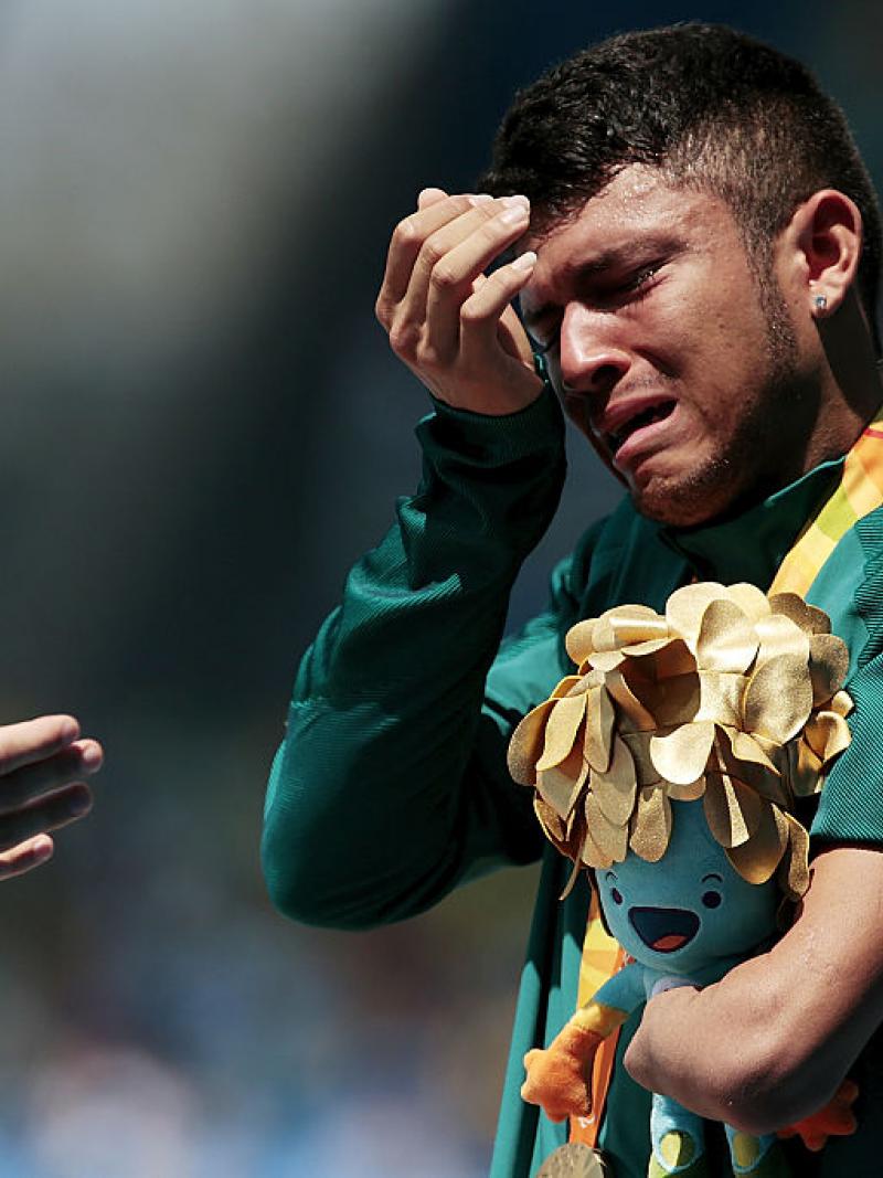 a Para athlete cries on the podium