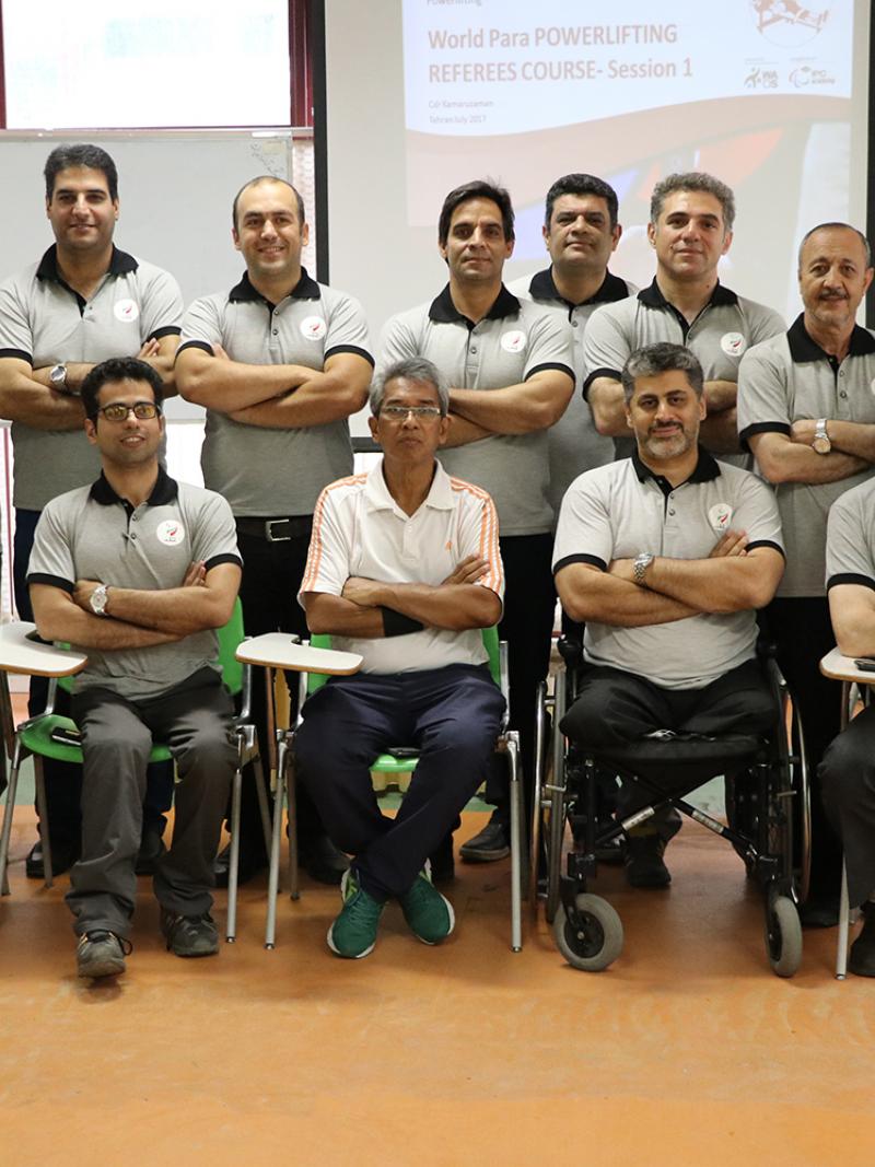 a group of officials pose for a photo