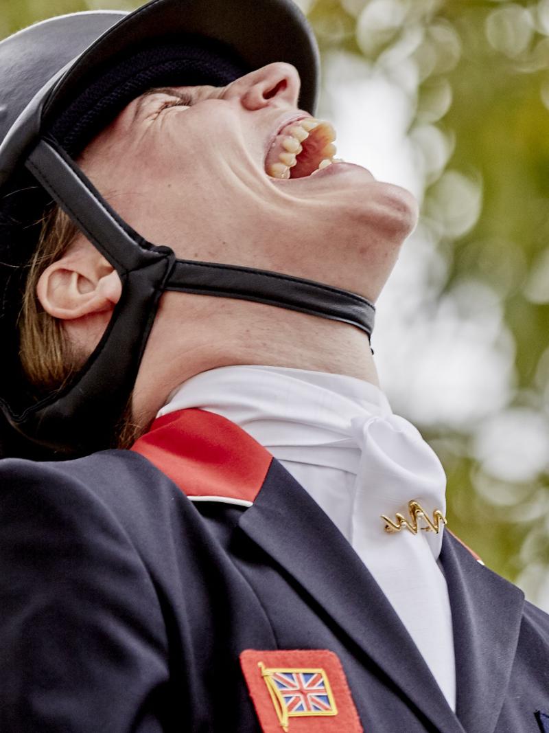 a Para equestrian rider laughing