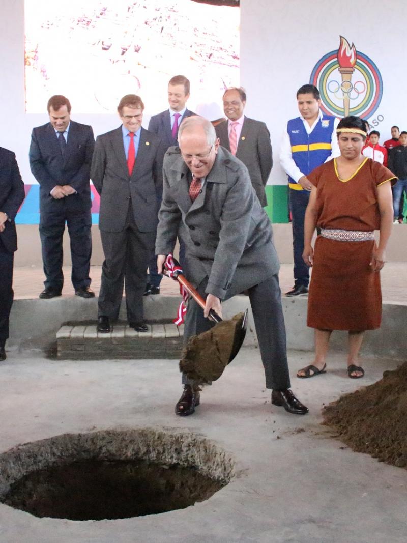 a man digs a hole in the ground