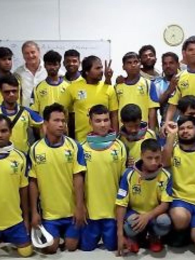 a group of visually impaired athletes smile for the camera