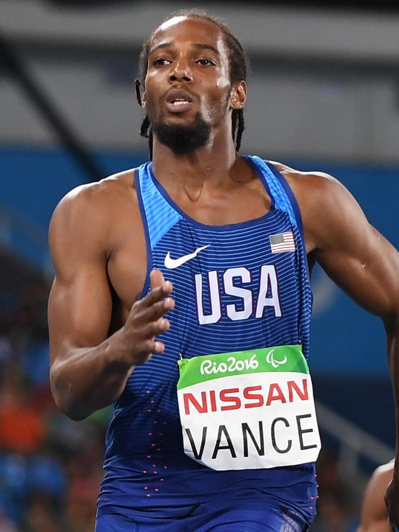 a male Para athlete sprints for the line