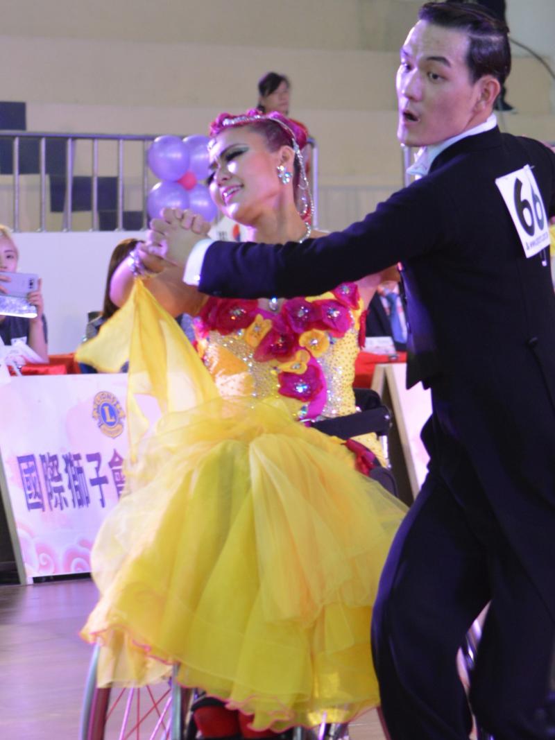 a Para dance couple perform a move