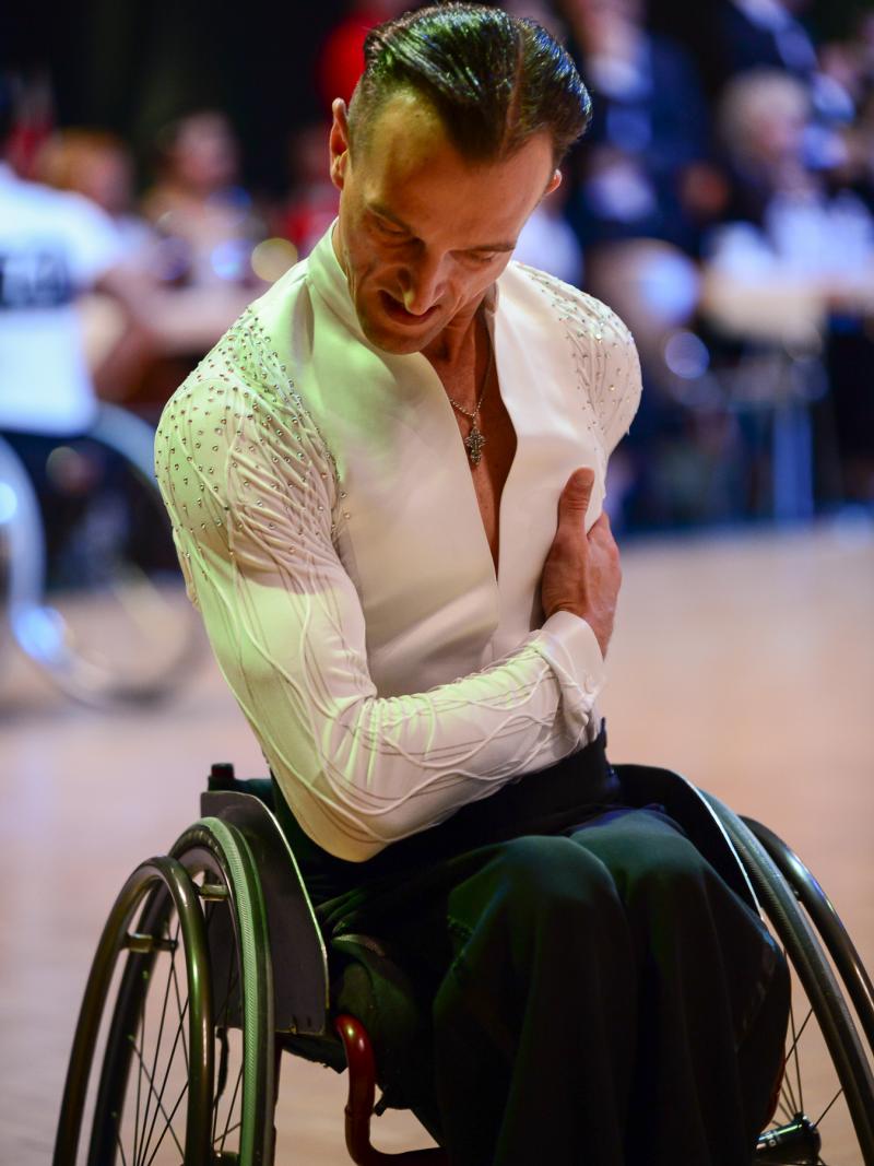 Male wheelchair dancer bows