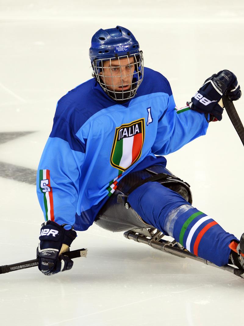 a male Para ice hockey player on the ice