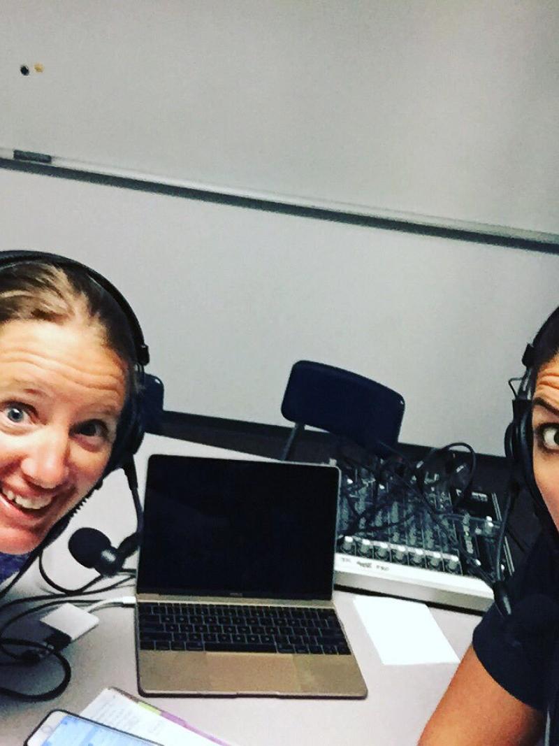 two women take a selfie in a studio