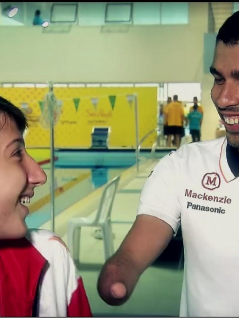 Man and a teenage boy smiling