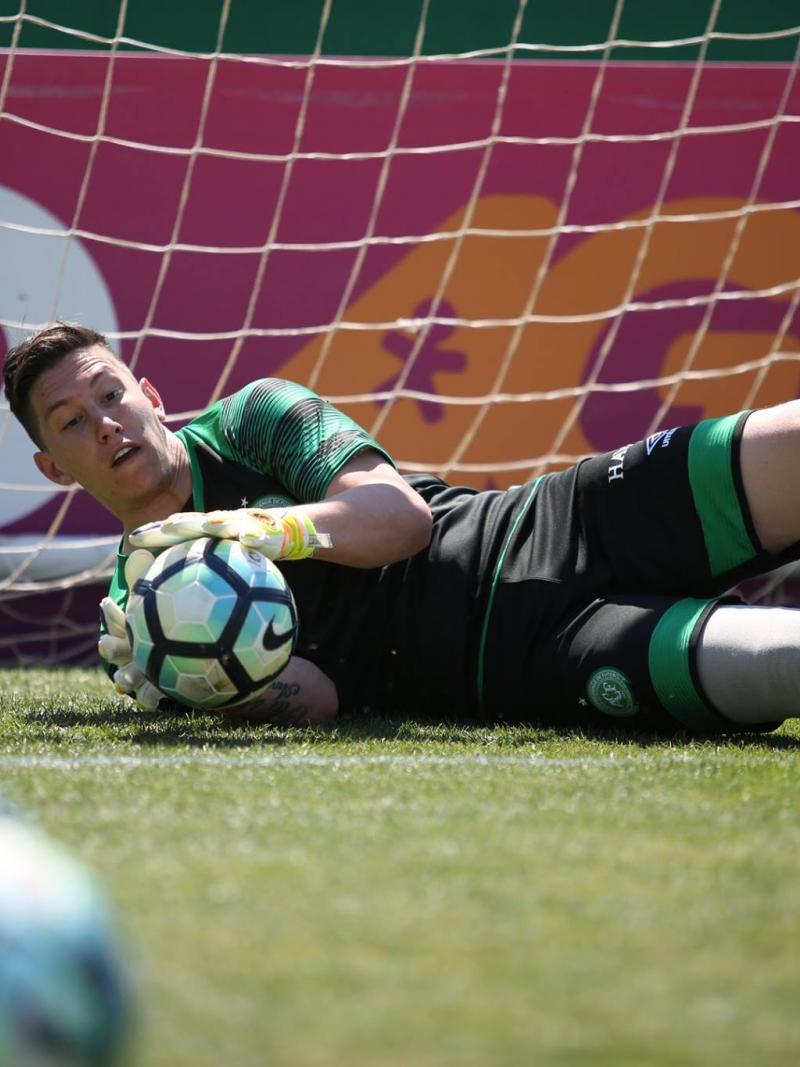 Person with a prosthetic leg practicing football as a goalkeeper