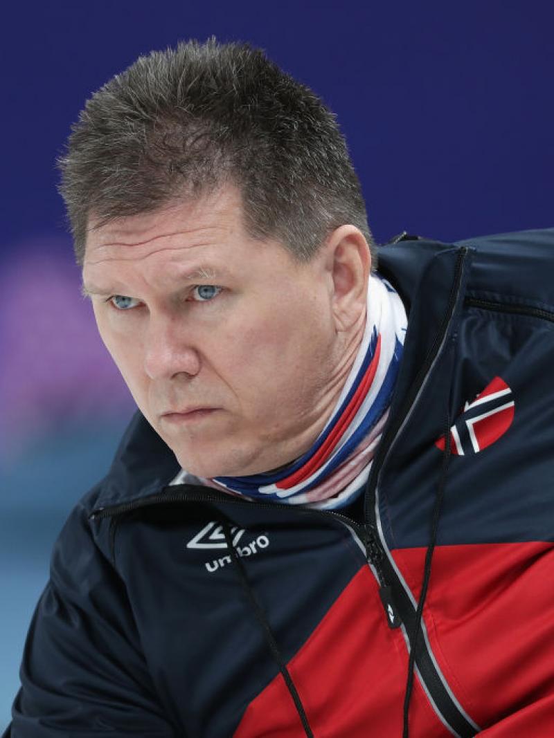 a male wheelchair curling player